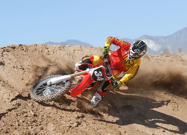 The CRF250R's handling is darn near perfect, with excellent steering precision and tremendous stability aided by Honda's HPSD system. It can carve like a knife yet remain as stable as an arrow at speed.