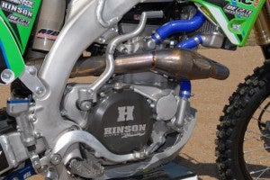A Vertex High Compression Piston Kit and Hot Cams Stage 2 cams pump up the stock KX's class-leading power and reshape it to produce more midrange and top-end torque than the stock motor. A Hinson Racing clutch kit and cover add durability as well as good looks. Same goes for the CV4 radiator hose kit.