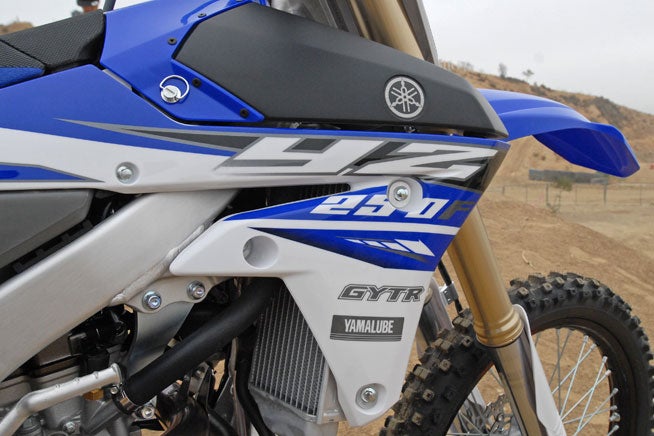 Just like last year, the 2015 YZ250F's graphics are embedded into the radiator shrouds for increased durability.