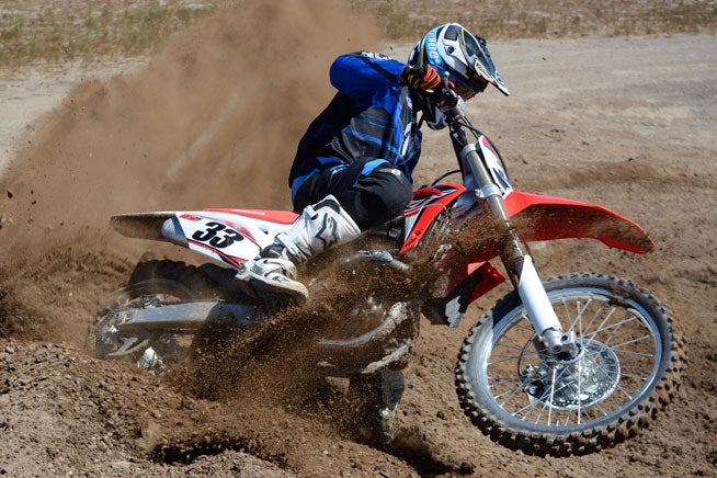 The CRF450R's engine is silky smooth yet plenty strong enough to put a hurtin' on any berm. Its Engine Mode Select feature makes changing ECU settings as easy as thumbing a button.