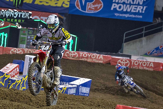 GEICO Honda's Malcolm Stewart (32) took advantage of a crash by Justin Hill to claim his first career 250cc supercross main event.