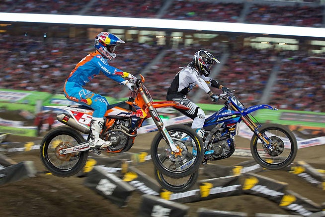 Ryan Dungey (5) battles with Weston Peick (23) at Levi's Stadium during round 15 of the Monster Energy AMA Supercross Series. Dungey went on to win the main event and record his 21st career 450cc supercross win. Peick finished a career-best third. PHOTOS BY RICH SHEPHERD.