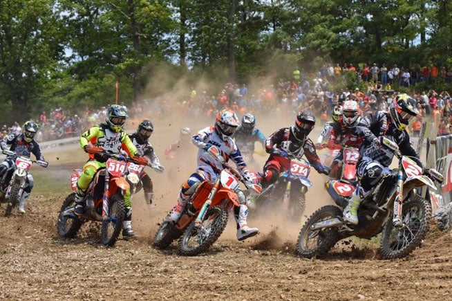 Josh Strang (2) outgunned Kailub Russell (1) for the holeshot, but Russell went on to take the lead and claimed his seventh AMSOIL GNCC win in eight rounds at the Wiseco John Penton GNCC in Ohio, June 7. PHOTOS BY KEN HILL.
