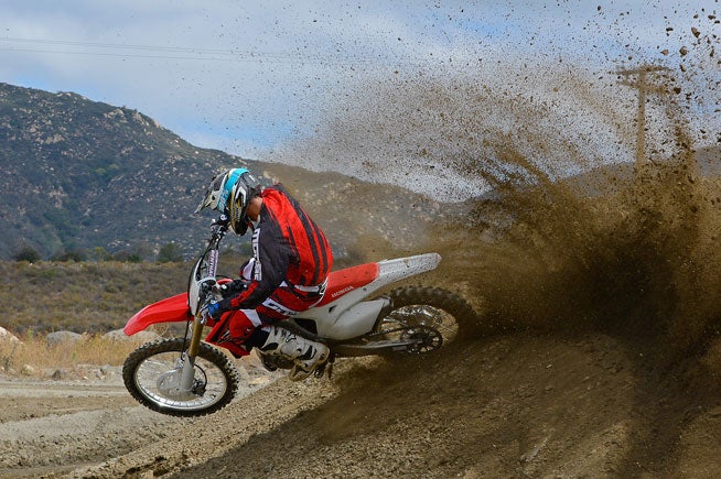 The front and rear suspension changes made to the 2016 CRF450R makes its engine actually feel faster even though it is spec'd identically to the 2015's. The difference is that the 2016 hooks up and gets with the program more efficiently, which makes it even easier to drive off of corners with authority.