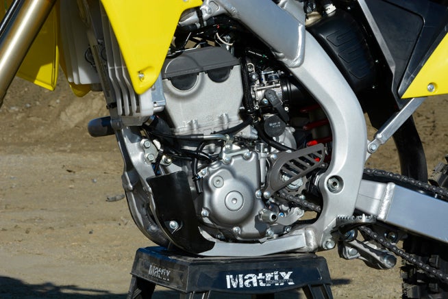 The RM-Z's, fuel-injected, DOHC  engine features the same 77.0 x 53.6mm bore and stroke as last year's model, but for 2016 it gets a new piston, a new top ring, new intake valves, a new crank, more compression and a new exhaust header, among other things, all working toward improving its low-end and mid-range power production.
