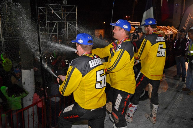 The team of Colton Udall. Mark Samuels and Justin Jones celebrates its win at the 2015 SCORE Baja 1000. The event will achieve its 50th Anniversary milestone as part of a four-race SCORE Desert World Championship in 2017. PHOTO BY SCOTT ROUSSEAU.