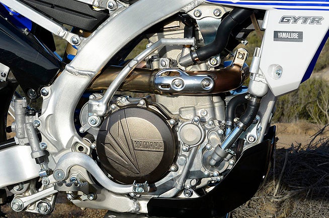 The FX's 449cc DOHC, fuel-injected engine shares much in common with the YZ450F that spawned it. Electric start and a revised ECU are the two biggest differences, although there are a host of subtle ones, such as the FX's lighter, more balanced crank. 