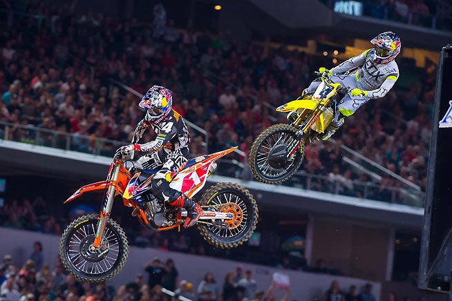 Ken Roczen (94) battled with Monster Energy Supercross Champion Ryan Dungey (1) and came away with the win at AT&T Stadium in Arlington, Texas, near Dallas. It was the sixth AMA 450cc Supercross win of Roczen's career. PHOTO BY RICH SHEPHERD.