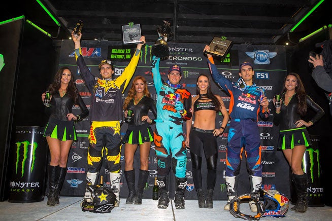 Dungey (center), Anderson (left) and Musquin (right) celebrated on the podium according to their race finishes. Only afterward did the AMA hand Dungey his two-position penalty, giving Anderson the win and Musquin second place. PHOTO BY RICH SHEPHERD.