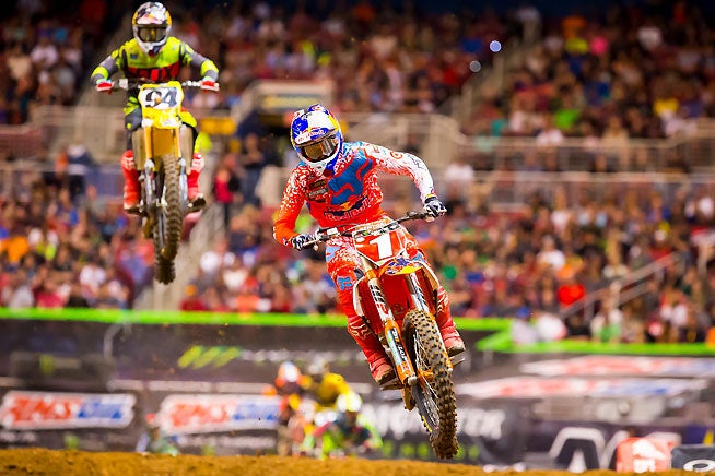 In a battle similar to that of last week's Indy Supercross, Ryan Dungey (1) scored the win in the St. Louis Supercross after beating back challenges by an aggressive Ken Roczen (94). PHOTO BY RICH SHEPHERD.