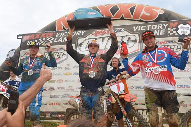 Russell (center) was joined by runner-up Josh Strang (left) and third-place finisher Thad Duvall (right) on the John Penton GNCC podium. PHOTO BY KEN HILL.