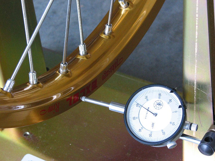 Here, a dial caliper is set to measure left-right runout.