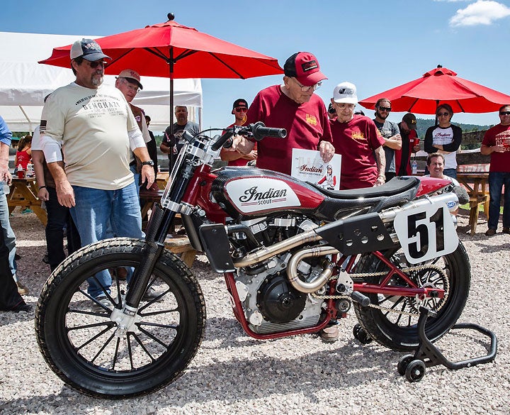 The men in the red shirts are Indian royalty. Bill Tuman (foreground) and Bobby Hill (background) were part of the fabled Indian Wrecking Crew factory race team in the 1950s. Hill won the AMA National Championship in 1951 and '52, and Tuman won it in '53.
