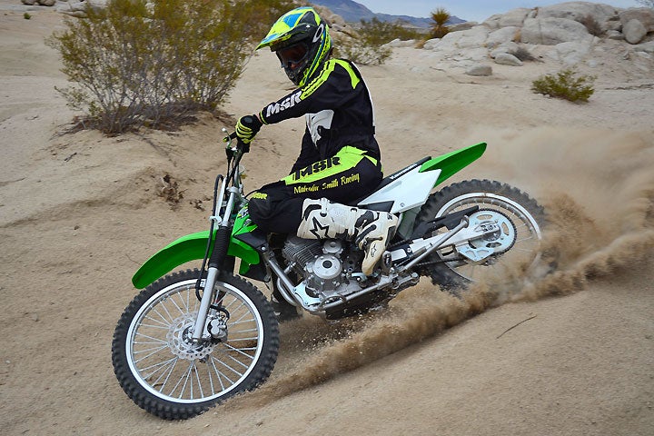 Kawasaki's KLX140G is designed primarily for adult-sized new riders, but its tough little SOHC engine kicks out enough power to peg the fun meter for experienced riders as well.