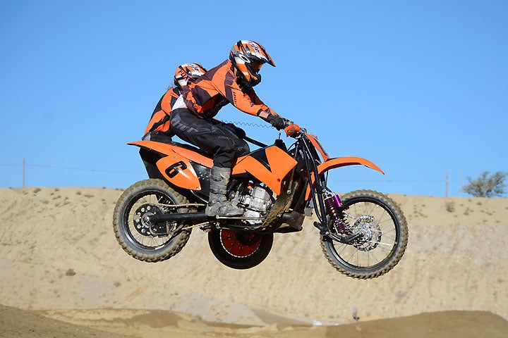 The husband and wife team of Mark and Kathy Wood are the reigning SoCal Sidecarcross class champions. Here the Woods are shown strutting their stuff at Los Angeles County Raceway in the High Desert.