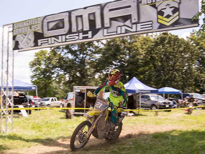 Ricky Russell crosses the finish line to win Moto 1 of the OMA Grouch XC in Illinois. Russell went on to finish second in Moto 2 to secure the overall win. PHOTO BY JOHN GASSO.