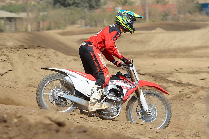 We know how it looks, but the CRF250R's front and rear supension actually do a pretty good job of padding hard landings.