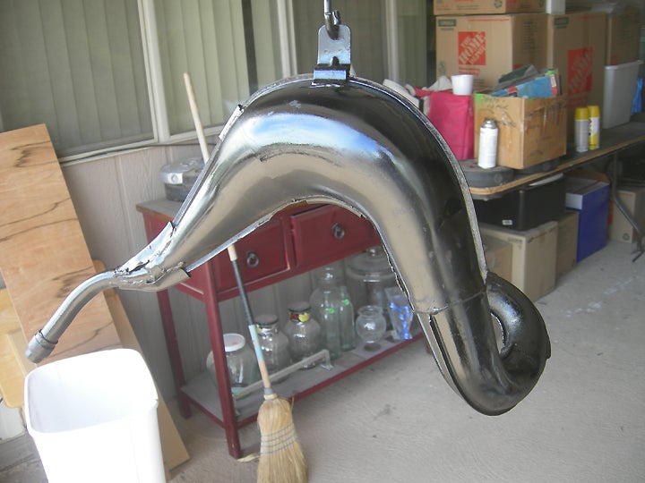 While we had the black paint handy, the exhaust pipe was carefully hung in the air and given a coat or two.