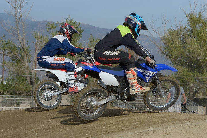 DirtBikes.com tester Nic Garvin (left) and teammate Nick Stover (right) get on it at the Glen Helen National track. The expert off-road racers weren't the slowest riders on the track, but they may have been having the most fun!