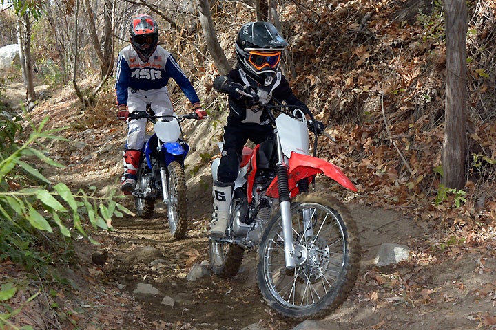 The CRF125F's four-speed transmission features an ultra-low first gear that is excellent for crawling along tight and technical trails. The Yamaha's five-speed transmission is better for faster riding.
