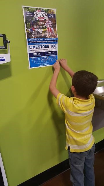 Dalen Lane helped out for the Limestone 100 by placing posters around town to inform the public of the upcoming GNCC race in Springville, Indiana.