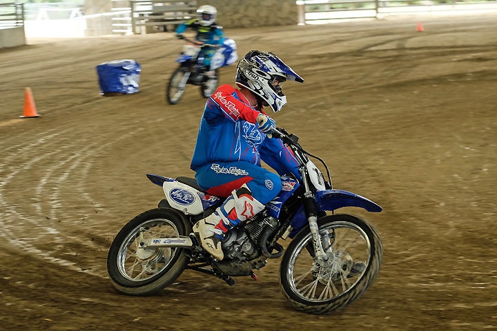 Better: With the elbow high, the rider is in a better position to keep the wheels in line and steer through the corner for a quicker and tighter exit.
