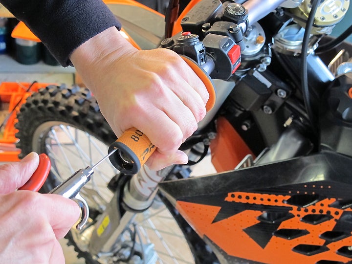 Squirting air between grip and bar allows easy removal of old grips without damage.