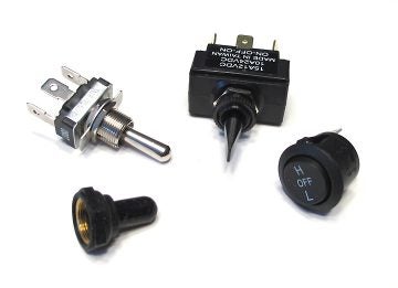 Some switches that come with grip heaters.  Metal one could be shrouded with rubber cover shown below it, and all are touted as adequately weather-proof, but we wonder for how long.