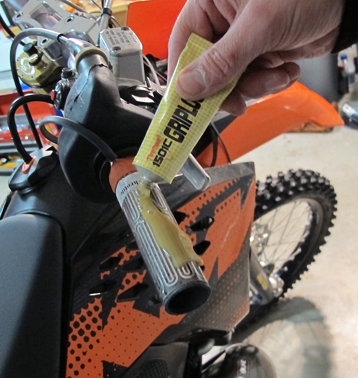 Three-Bond Grip Lock is slippery when wet and heat-resistant when cured.  Notice throttle tube extends well off end of the bar during grip installation to avoid gluing tube to bar.