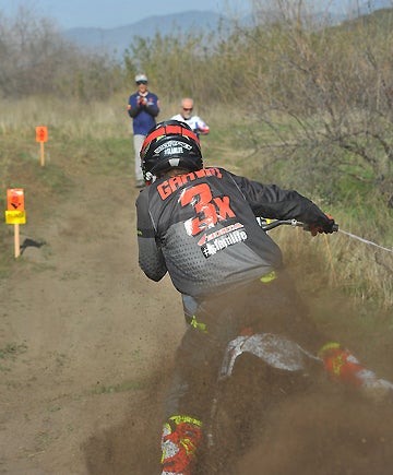 DirtBikes.com test rider Nic Garvin blasts out of the final turn in the enduro special test. PHOTO BY MARK KARIYA.