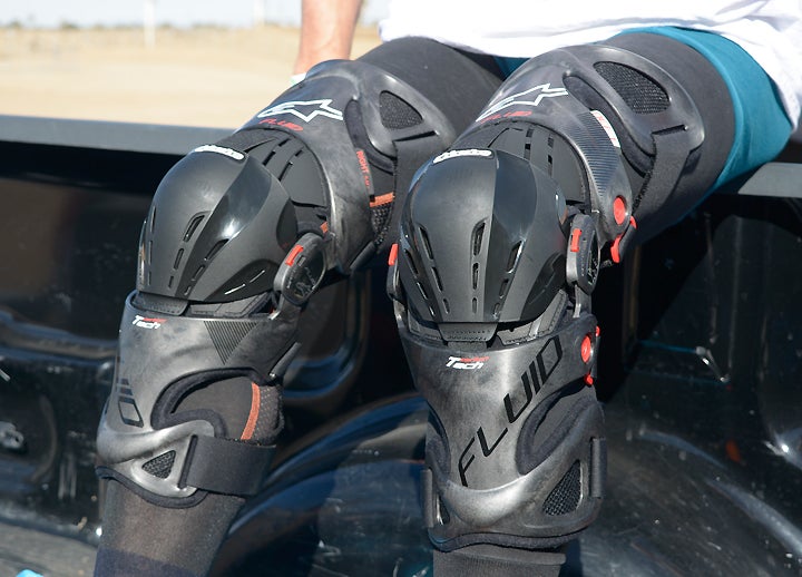 Alpinestars Fluid Tech Carbon knee braces boast the Italian company's latest design philosophies in a lightweight, secure and comfortable knee brace that is intended to keep your knees from getting trashed while riding.