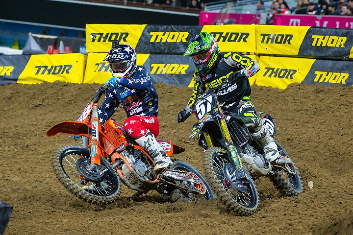 Jimmy Decotis (right) led the San Diego 250SX West main event for a long way, but Troy Lee Designs/Red Bull/KTM's Shane McElrath (left) powered through the pack from fifth place to take his 250SX main event win in as many weeks. PHOTO BY RAS PHOTO.