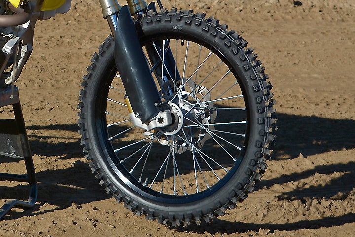 The 250mm front rotor on the Suzuki looks tiny compared to the other brakes in the 450cc class. While braking is linear, front and rear, the Suzuki simply lacks the same pucker power as some of its rivals.