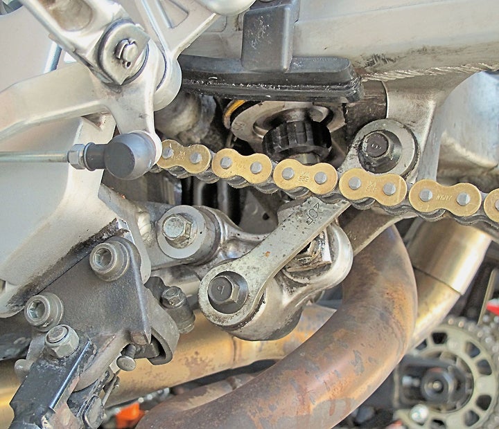 Shock linkages usually live in crowded, nasty places. They don’t present the most inviting DIY prospects, but they’re essential to good rear suspension performance, and their actual maintenance needs are fairly simple. Most of the work is just getting to them.