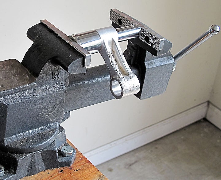 For parts that can be pulled off the bike, a vice works very efficiently to press the narrow socket through the bore, thereby extracting the bearings. It’s easier than using our tool, although a third hand might be needed to get everything lined up, and extra care is needed to avoid accidental damage.